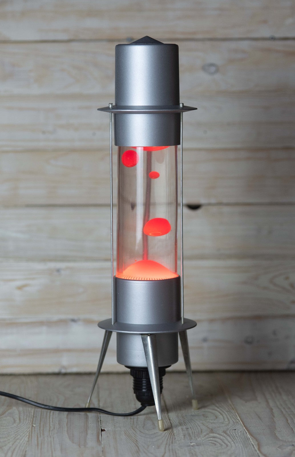 Side view of aluminum Soviet Raduga lava lamp with red wax